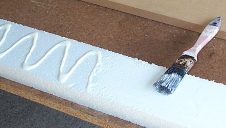 Photo of spreading PVA glue onto strofoam