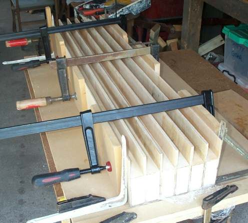 Photo of one full set of identical diffuser wells clamped for drying